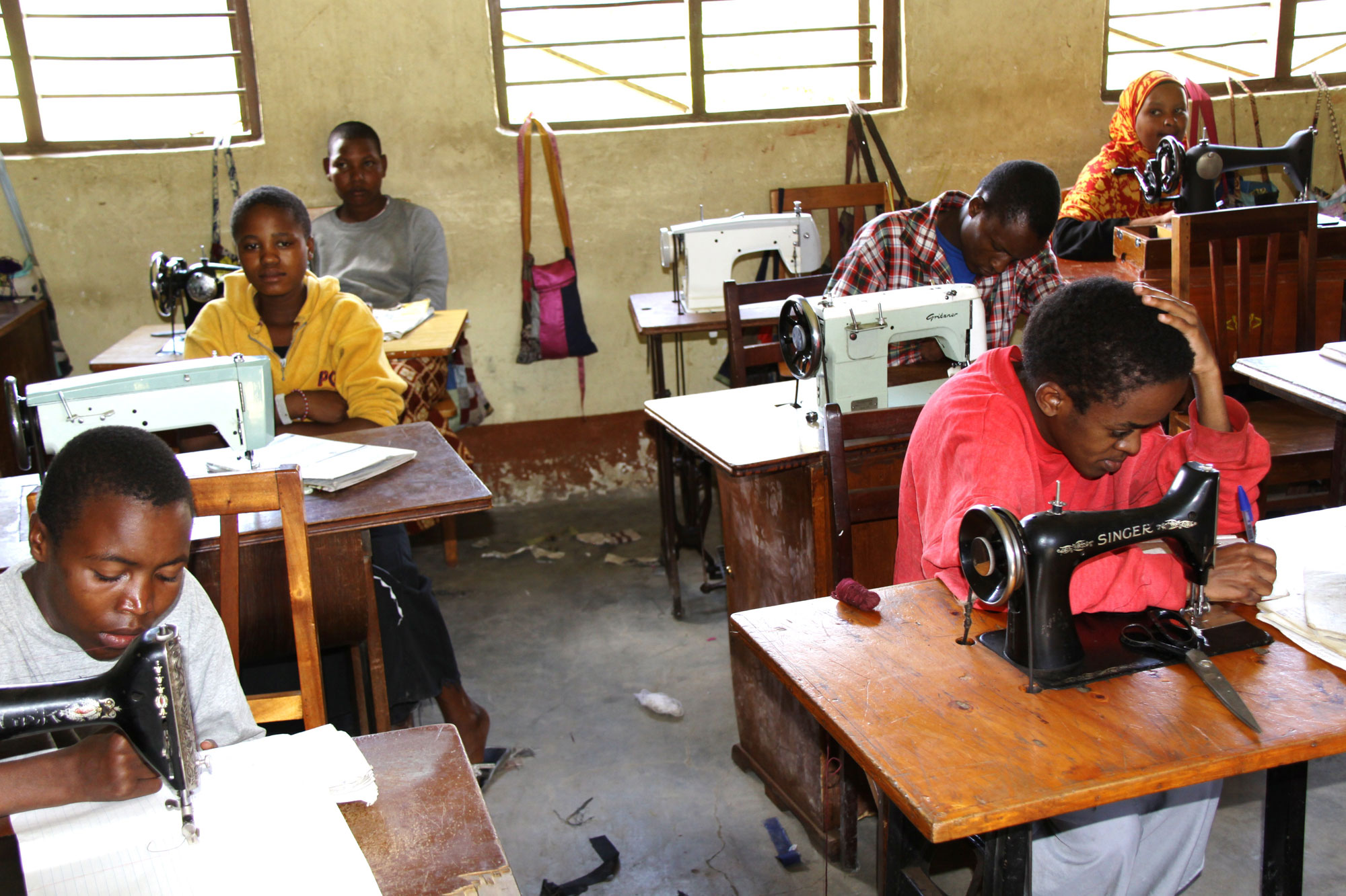 Travel Medicine - Father Pat’s school for the disabled – students learning to sew.